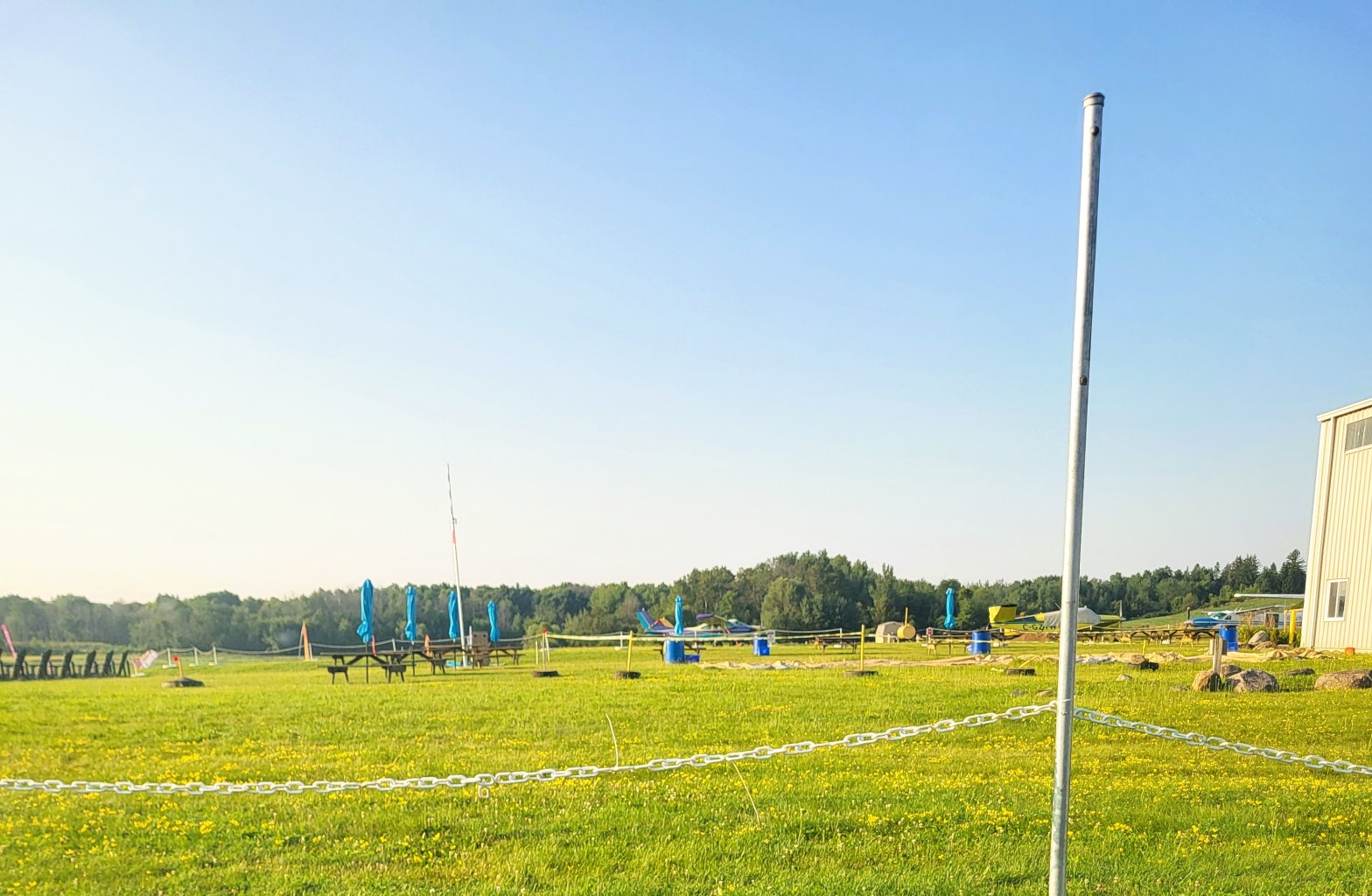 Image of the field next to the Skydive Toronto hangar as viewed from the parking lot